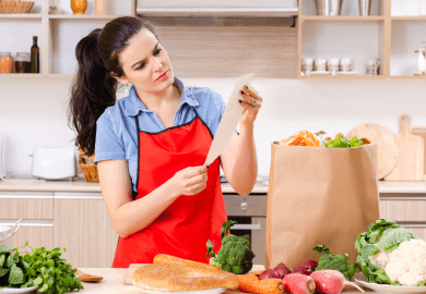 Woman unpacking groceries at home